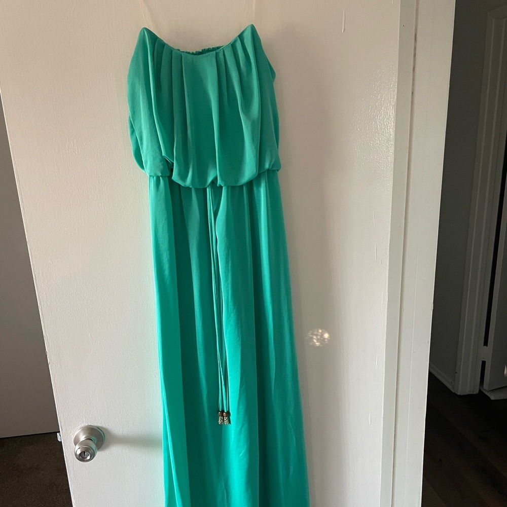 Long green satin strapless dress